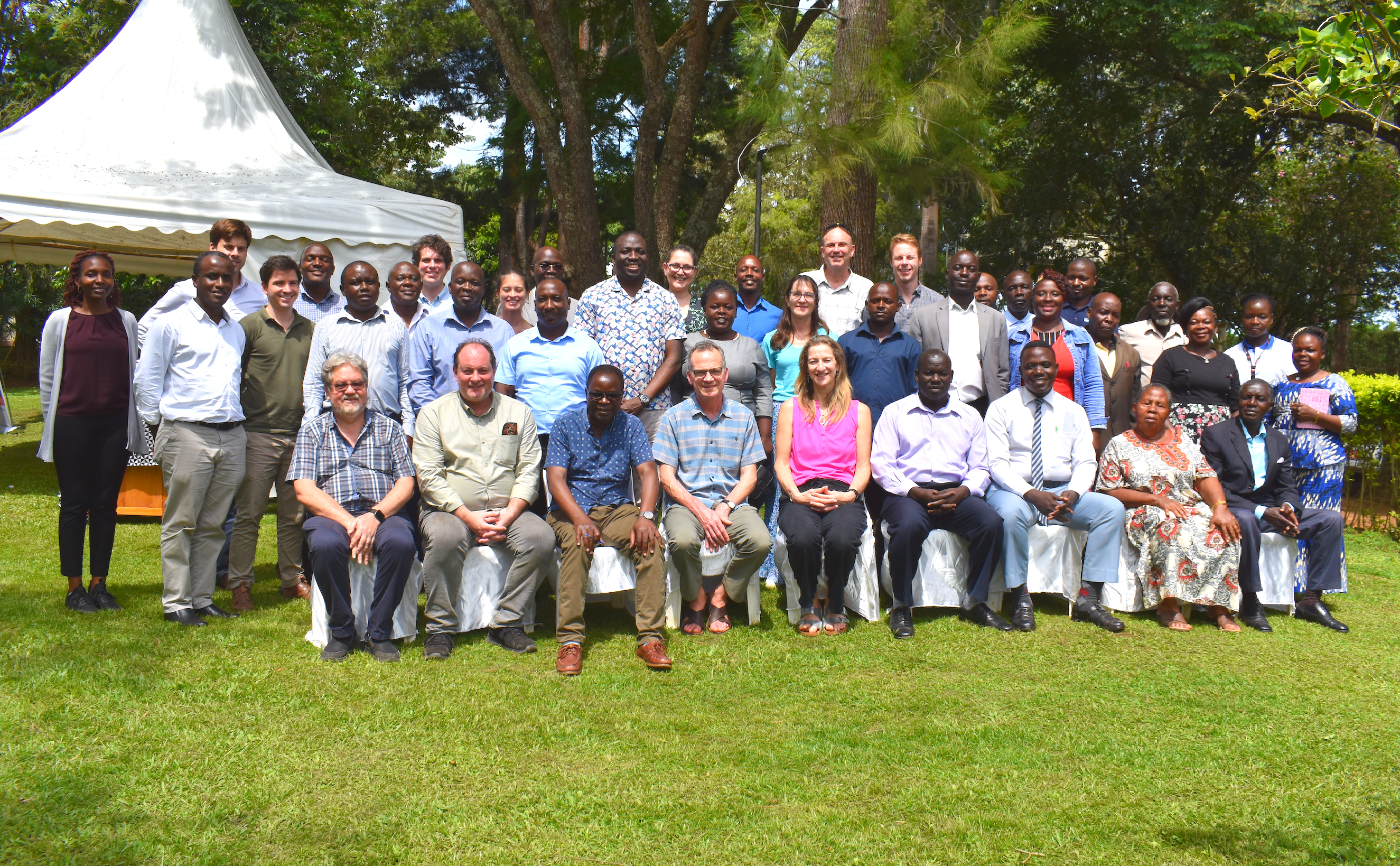 A team of Unit staff and partners posing for a photo