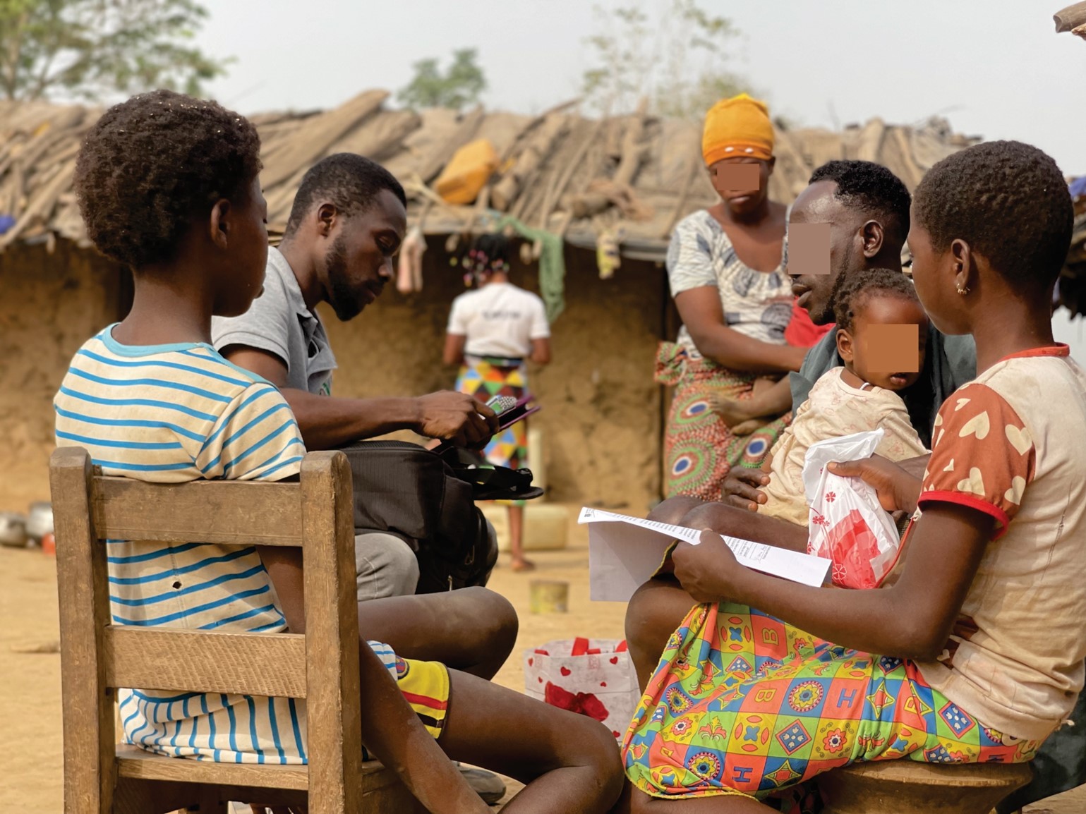 SHARP Formative study:  Field activity at Gyereso, Nyinahin District, Ashanti Region. Mr. Daniel Okyere, a Research Assistant from NMIMR interviewing a caregiver in the presence of the affected child.