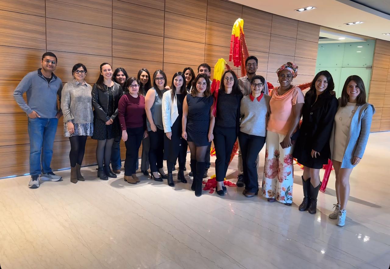 15 men and women line up for a photo at the writing workshop