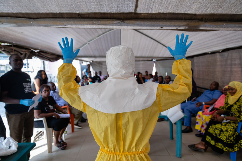 Dr Abdulmajid Suleiman Musa shows a group of NCDC staff how a correctly prepared PPE suit should look when working in a virus hit region, Keffi, Nasarawa state.