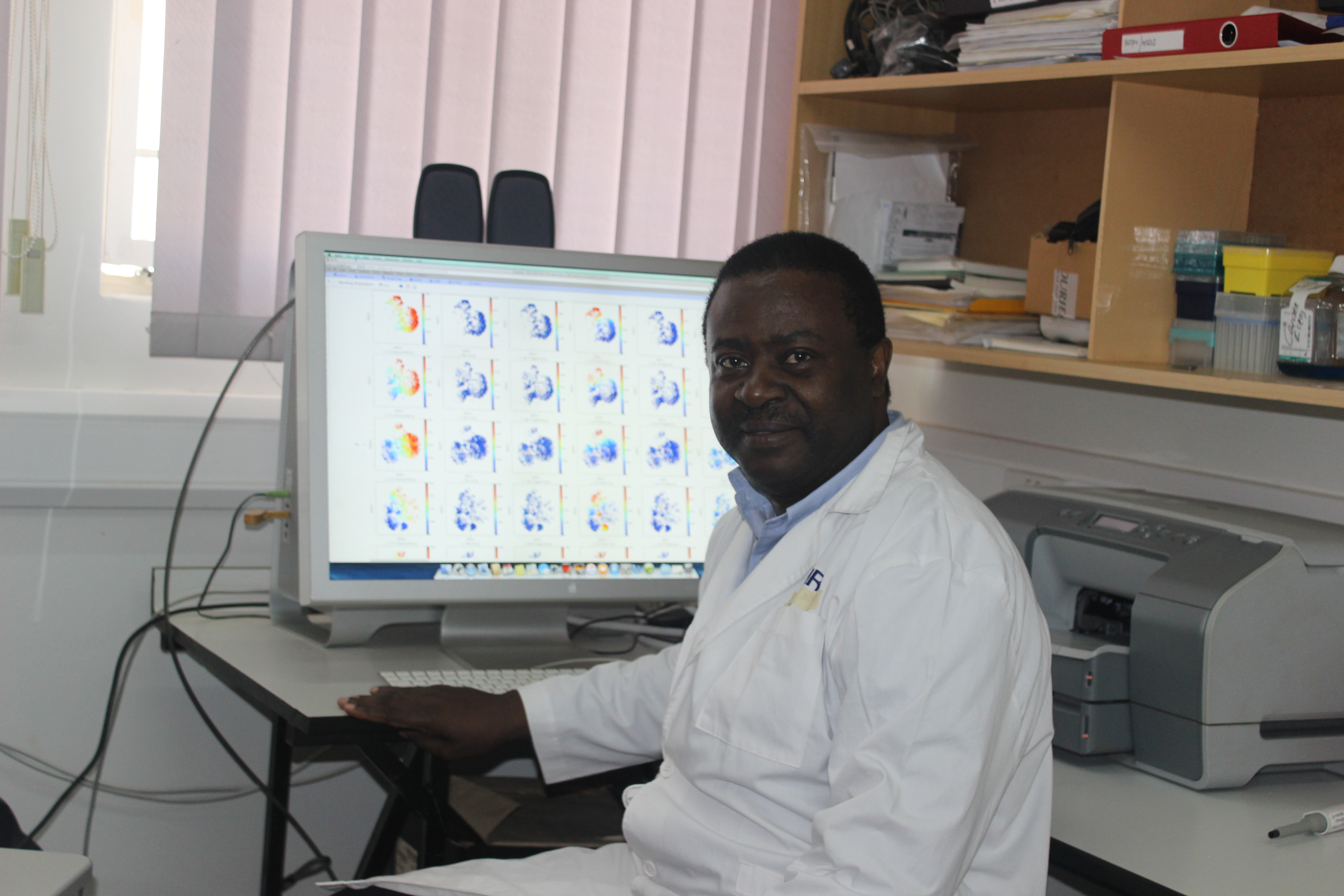 Prof Pontiano Kaleebu Director of MRC Uganda Uganda Virus Research Institute at his desk in Entebbe