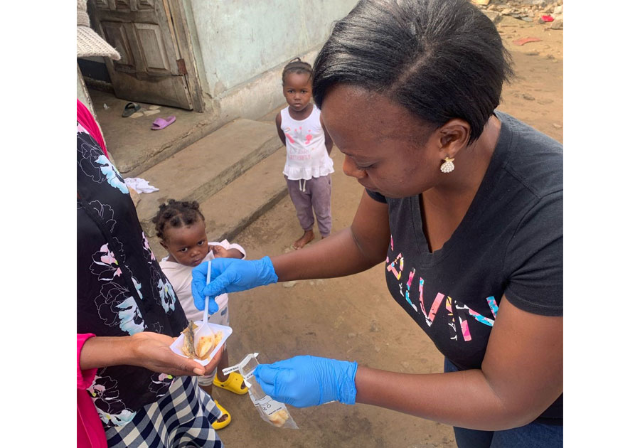 Jenala collecting food samples from a household in a community in Maputo