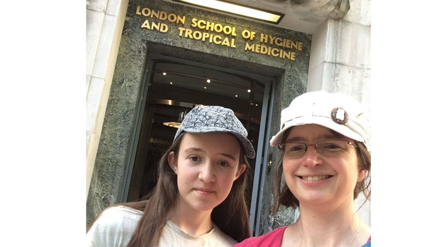 Melissa Andrew with her daughter outside the LSHTM entrance