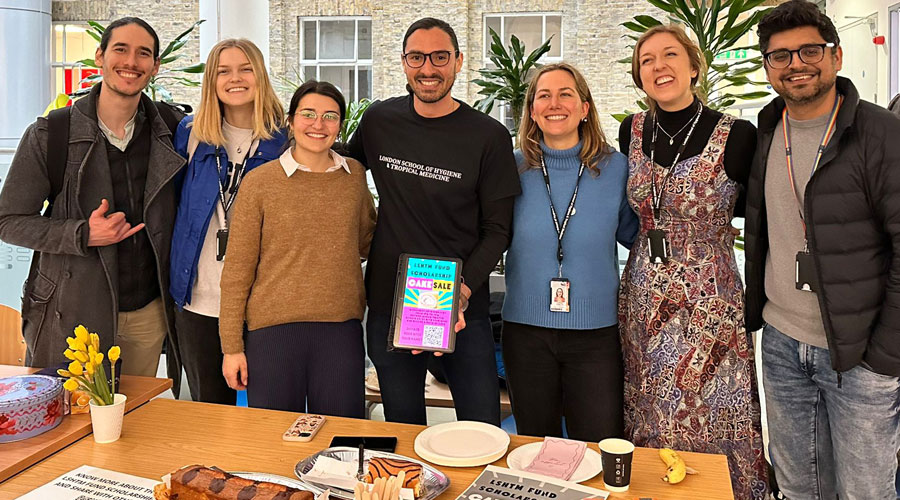 Sebastian with fellow students at his cake sale to raise money for the LSHTM Scholarship Fund as part of his Cambridge Half Marathon Fundraising.  