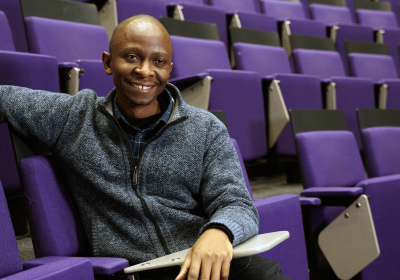 Andrew in an LSHTM lecture theatre.