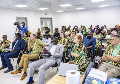 A group of people in a seminar room at MRCG 