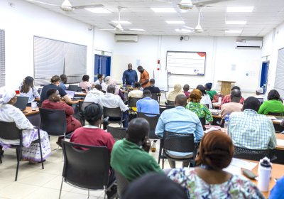 Group of individuals in a meeting room at MRCG