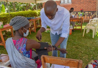 Allan Kalungi interacting with a research participant