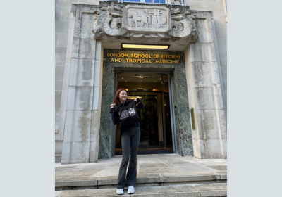 Whitney Chan standing outside LSHTM Keppel Street Entrance