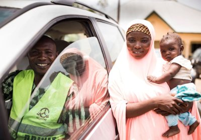 Photo by Transaid.  ETS driver and the mother that he transported to the health clinic with her child.