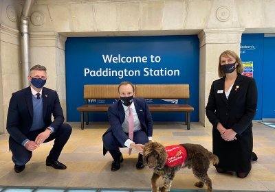 Professor James Logan, Matt Hancock and Dr Claire Guest at Paddington Station with one of the trial dogs, Asher