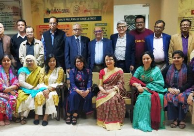 Group of alumni based in Dhaka, Bangladesh posing for a picture at their meeting