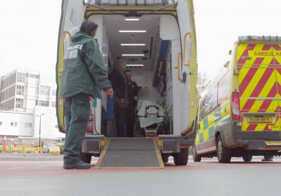 Paramedics preparing to bring a patient out the back of an ambulance at Queen Elizabeth Hospital, Birmingham. Credit: The Clinical Trials Unit, LSHTM.