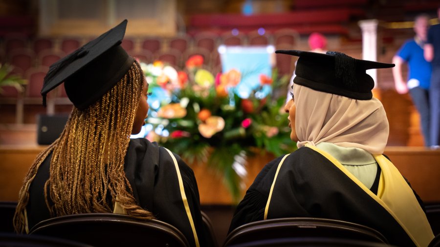 Graduates wearing graduation gowns