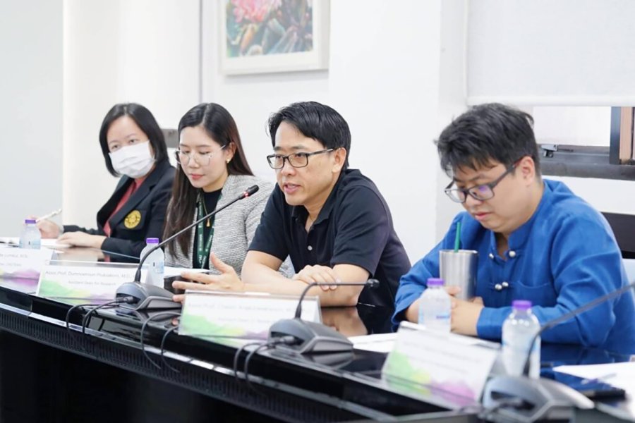 Four Thai health professionals, two women and two men, speak on a panel at a conference