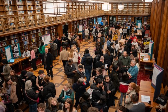 Crowds of people at the open evening taking place in the LSHTM Library.