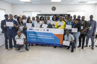 A group picture showing people holding certificates