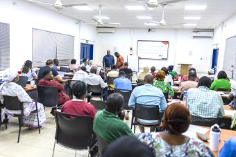 Group of individuals in a meeting room at MRCG